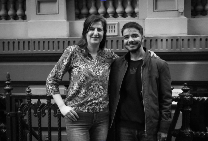 Sherry from Civik People with Elyas, a young man Sherry supported into employment with Australia Post.